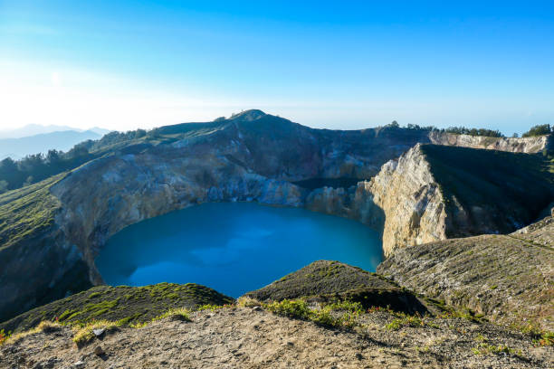 istock Kelimutu - Turquoise colored volcanic lake 1199887764