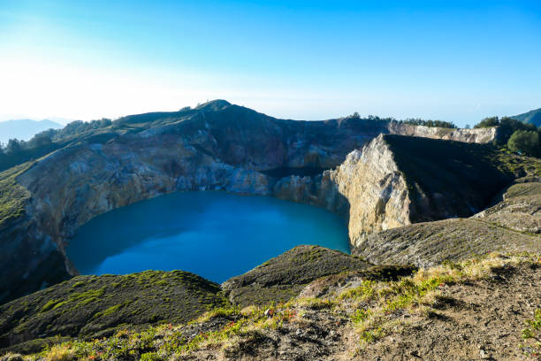 istock Kelimutu - Turquoise colored volcanic lake 1199887792
