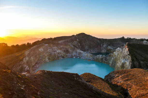 istock Kelimutu - Turquoise colored volcanic lake 1199887905