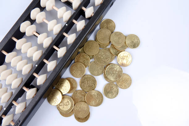 istock Abacus and coins. Business concept 1199888747