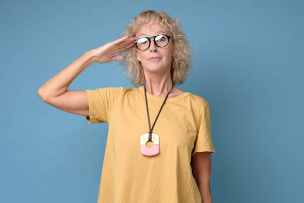 istock . Mature woman is ready to start working. Studio shot 1199890667