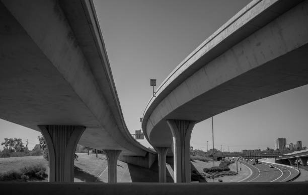 istock Black And White Elevated Highways Near City 1199891450