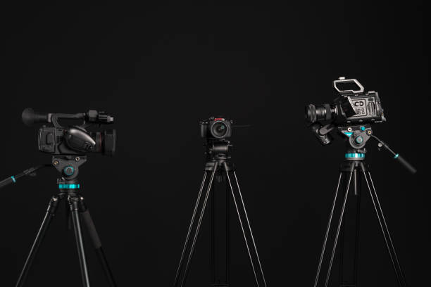 three different types of video cinema photo camera on black - television camera tripod media equipment videography imagens e fotografias de stock