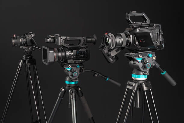 istock Three types of video cinema photo camera on black background, side view 1199894585