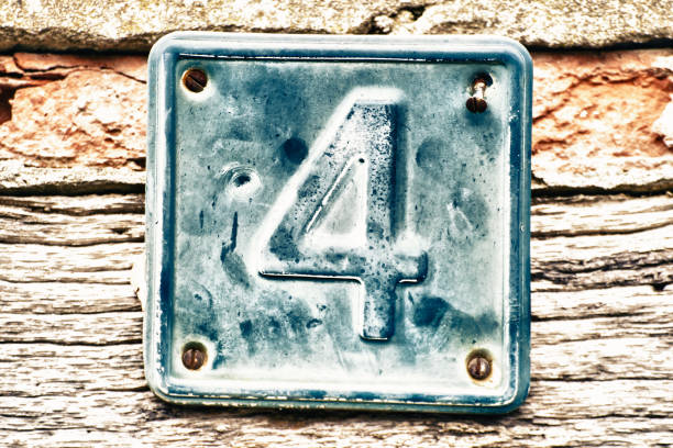 istock Plate with number four on old wall 1199897520