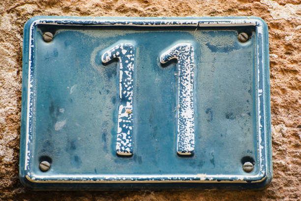 istock Plate with number eleven on old wall 1199897566