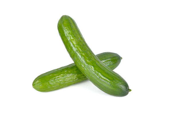 istock unpeeled fresh Japanese cucumbers on white background 1199897603