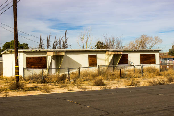 istock Abandoned Duplex With Boarded Up Windows 1199899945
