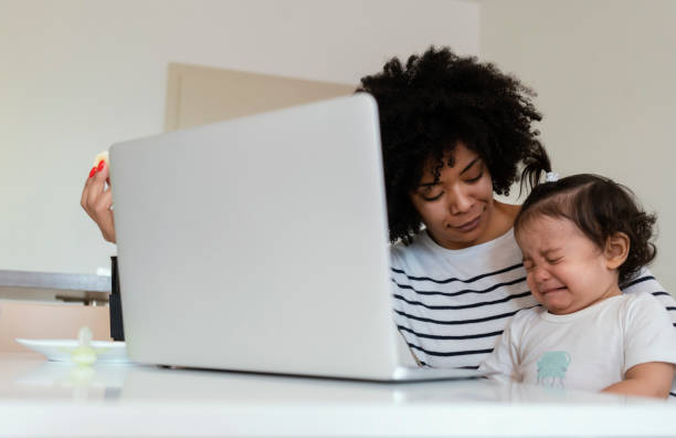 istock Mom and babies at home 1199900367