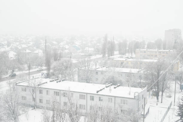 istock Snow blizzard in a small town. Everything is covered with white snow. 1199900886