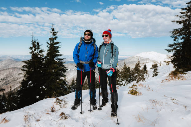 istock Couple  climbers are looking at winter mountains 1199902148