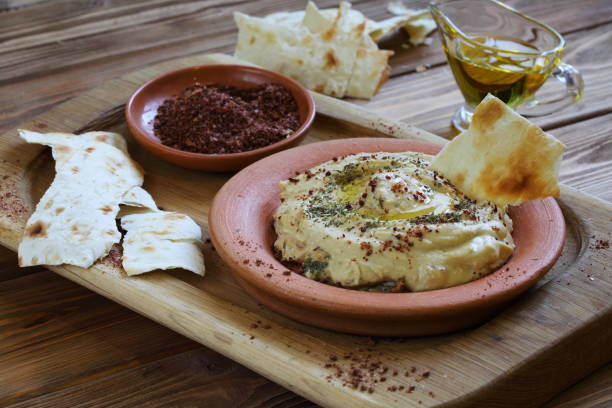 istock Hummus and pita on a wooden table 1199905169