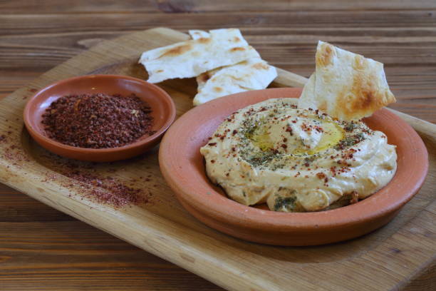 istock Hummus and pita on a wooden table 1199905226