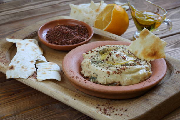 istock Hummus and pita on a wooden table 1199905265