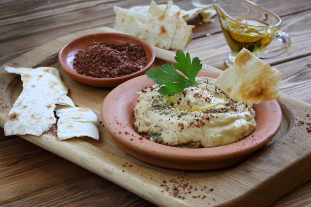 istock Hummus and pita on a wooden table 1199905275