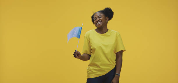 istock Woman waving EU flag 1199906043