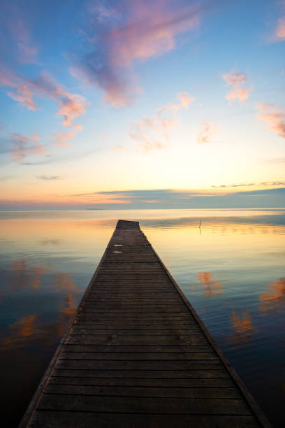 istock wooden pier in the sunset 1199906387