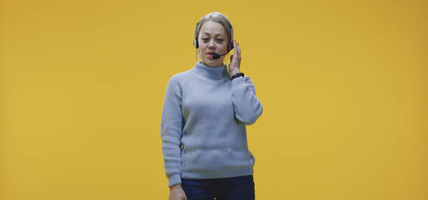 istock Call center employee with headset 1199906424