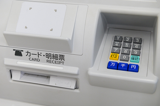 Close up of keyboard and insert card of Japanese ATM machine.