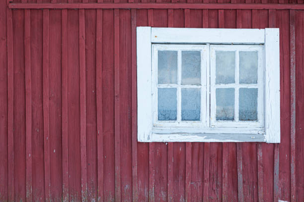 istock Old shed frozen window and wall at winter 1199908054