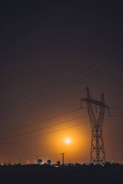 istock Low Angle View Of Silhouette Electricity Pylon Against Sky During Sunset 1199908234