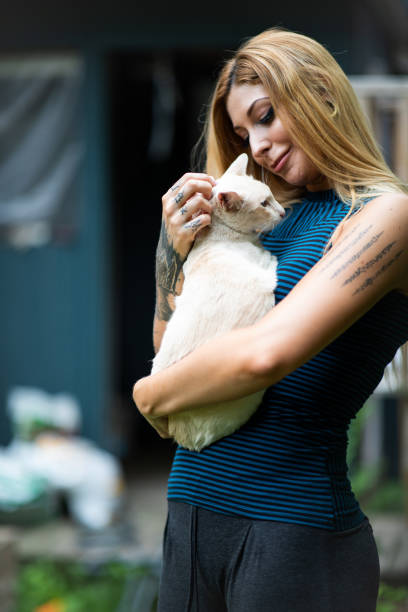 istock Cute Cat Owner Cuddling With Her Pet 1199909018