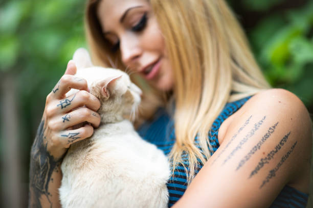 istock Cute Cat Owner Cuddling With Her Beloved Pet 1199909159