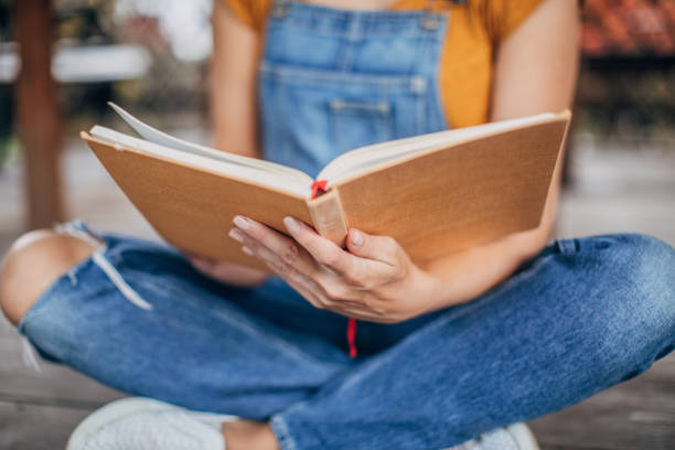 istock Woman reading a book for exam 1199909312