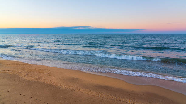istock Blurred motion of  waves on beach 1199912340