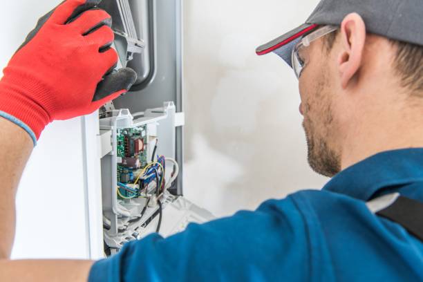 Gas Furnace Issue Technician Servicing Residential Heating Equipment. Central Heat Gas Furnace Issue. furnace stock pictures, royalty-free photos & images