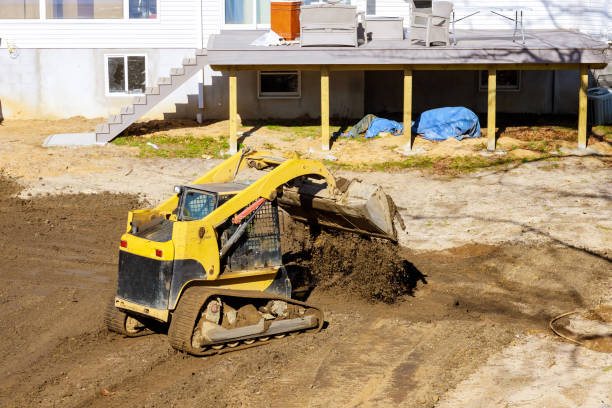istock Mini bulldozer with earth doing landscaping works 1199917614