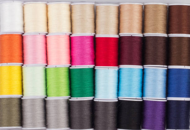 istock colorful of cone threads in packaging isolated 1199919267