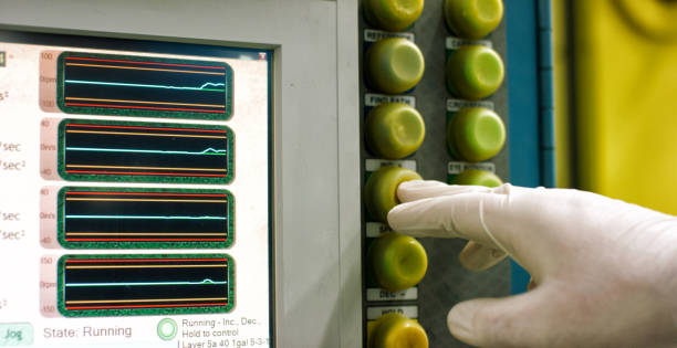 istock A Technician Wearing Protective Gloves Pushes a Button on a Computer in an Indoor Manufacturing Facility 1199922180