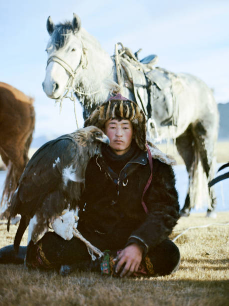 istock Portrait of eagle hunter near the river  in Mongolia 1199923499