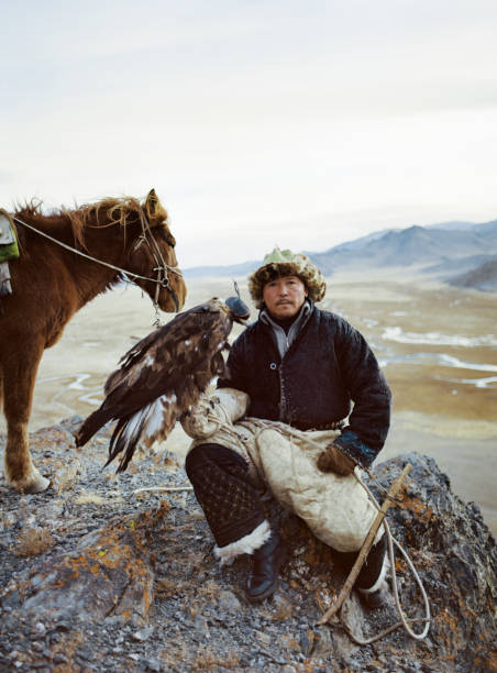 istock Portrait of eagle hunter near the river  in Mongolia 1199923504