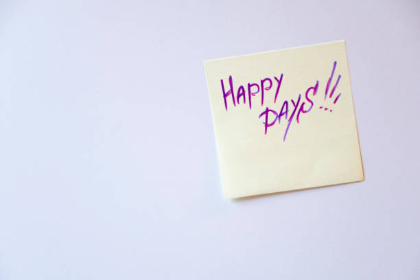 istock Sticker on a white wall with the message: Happy days. Concept, good wishes. 1199924949