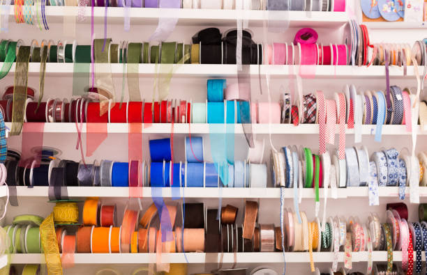 istock Colored ribbons on needlework store shelves 1199928233