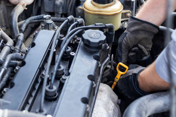 istock A man repairs a car himself 1199931626