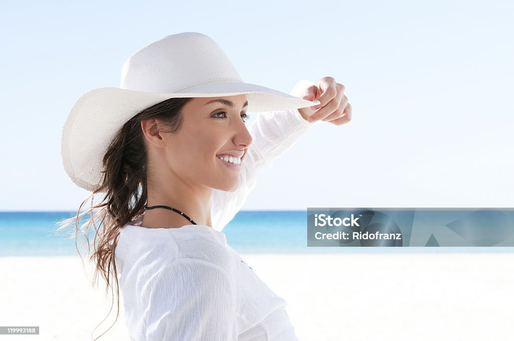 Happy girl at tropical beach Beautiful girl relaxing and smiling outdoor at summer beach. Beach Stock Photo