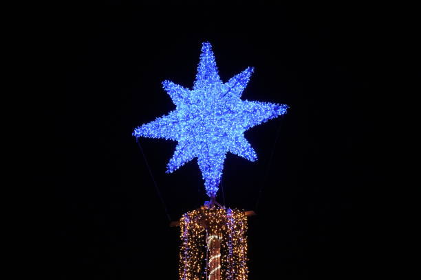 Christmas tree in Palma de Mallorca Palma - Mallorca - Spain - January 03, 2020. Christmas lights at Moll Vell Marina in Palma. christmas star shape christmas lights blue stock pictures, royalty-free photos & images