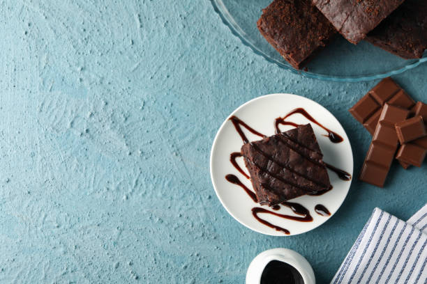 istock Composition with chocolate cake slices on blue background, space for text 1199940250