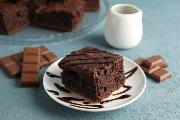 istock Composition with chocolate cake slices on blue background, close up 1199941123