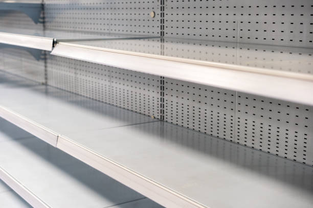 Empty supermarket shelves Supermarket shelves without any stock. sold out photos stock pictures, royalty-free photos & images
