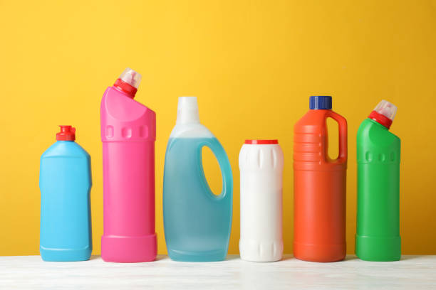 istock Set of bottles with detergent on yellow background, space for text 1199943055