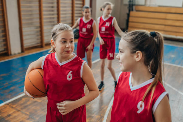 istock Female School Basketball Team 1199943244
