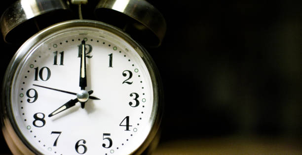 istock A Silver-Colored, Metal, Retro-Style, Analog Alarm Clock at 8:00 1199944910