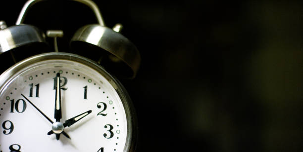 istock A Silver-Colored, Metal, Retro-Style, Analog Alarm Clock at 2:00 1199944940