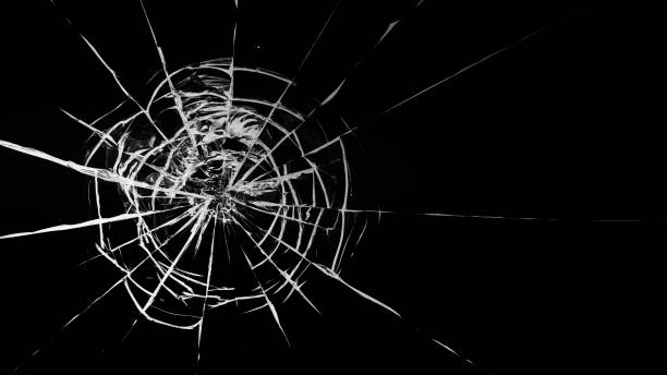 istock Round white cracks in glass on black background. 1199951372
