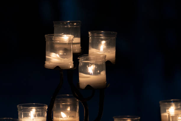 istock votive candles inside a church isolated on black 1199952032