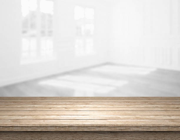 istock rustic blank wooden table top in front of blurry room 1199952816